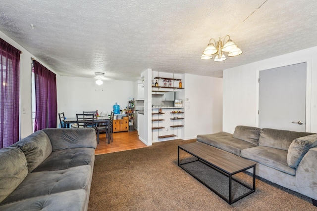 699 Cherry Hollow Rd Unit A, Columbus, OH 43228 - living room featuring a chandelier, carpet floors, and a textured ceiling