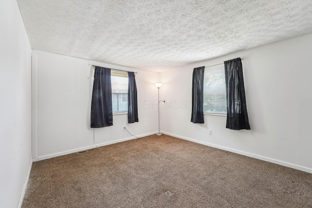 699 Cherry Hollow Rd Unit A, Columbus, OH 43228 - carpeted spare room featuring a textured ceiling and baseboards