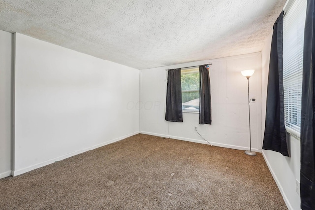699 Cherry Hollow Rd Unit A, Columbus, OH 43228 - carpeted empty room with a textured ceiling and baseboards