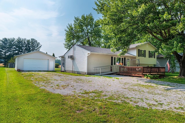 1892 County Road 170, Marengo, OH 43334 - view of front facade with a deck, an outdoor structure, a garage, and a front yard