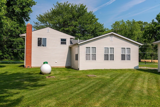 1892 County Road 170, Marengo, OH 43334 - rear view of house with a lawn and a chimney