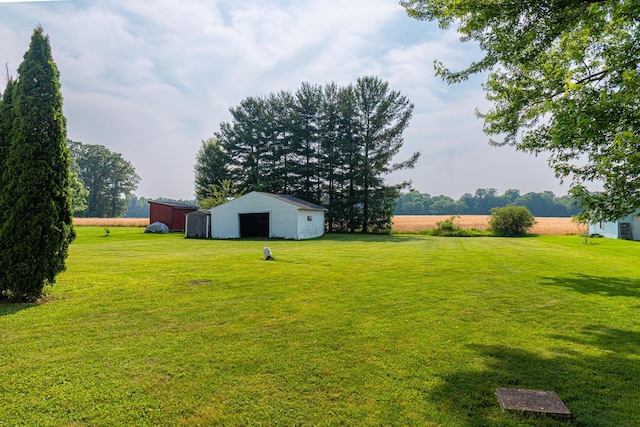 1892 County Road 170, Marengo, OH 43334 - view of green lawn featuring an outbuilding and a detached garage