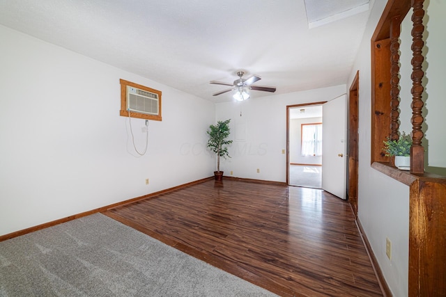 1892 County Road 170, Marengo, OH 43334 - spare room with a wall unit AC, a ceiling fan, and wood finished floors