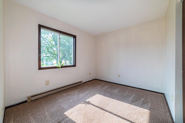 1892 County Road 170, Marengo, OH 43334 - unfurnished room with baseboard heating and carpet flooring