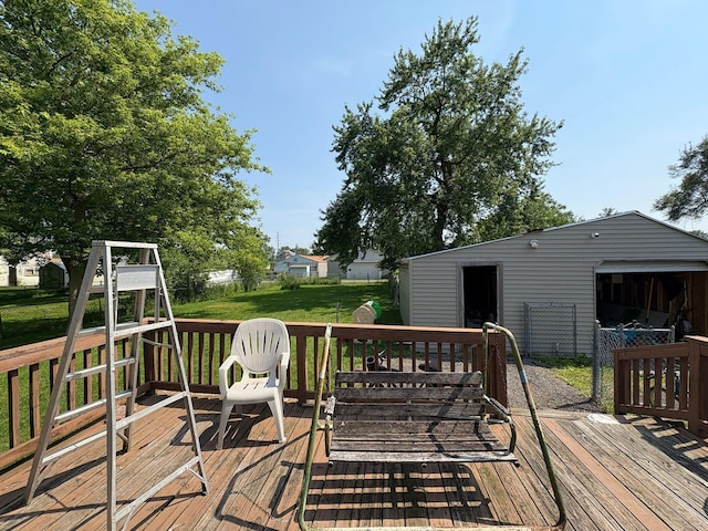 659 E Mark St, Marion, OH 43302 - wooden terrace featuring an outdoor structure and a lawn