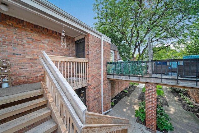 1551 Lafayette Dr Unit B, Columbus, OH 43220 - view of exterior entry with brick siding and a wooden deck
