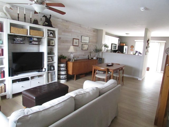 6038 Phar Lap Dr, New Albany, OH 43054 - living room featuring a ceiling fan and light wood-type flooring
