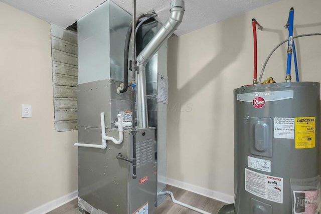 3784 Armuth Ave, Columbus, OH 43219 - utility room featuring electric water heater and heating unit