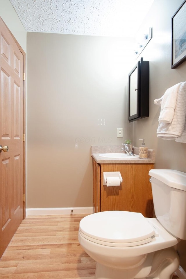 237 Harvard Loop, Delaware, OH 43015 - half bathroom with vanity and wood finished floors