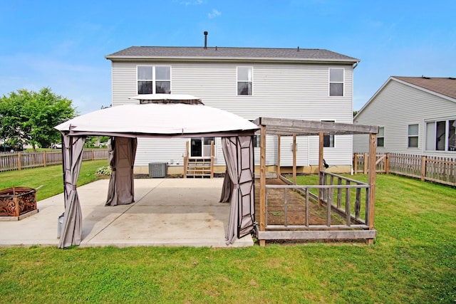 237 Harvard Loop, Delaware, OH 43015 - rear view of house featuring a gazebo, a fenced backyard, a patio area, and a fire pit