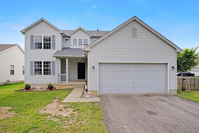 237 Harvard Loop, Delaware, OH 43015 - view of front of house featuring driveway, covered porch, an attached garage, and a shingled roof