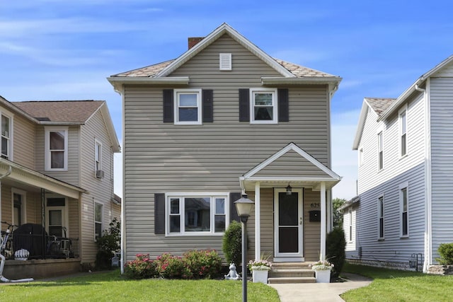 625 E Mulberry St, Lancaster, OH 43130 - traditional home with a front lawn and a chimney