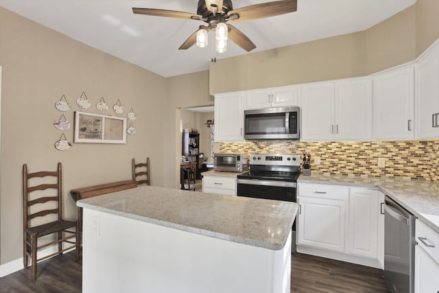 625 E Mulberry St, Lancaster, OH 43130 - kitchen featuring stainless steel appliances, dark wood-type flooring, tasteful backsplash, and a ceiling fan