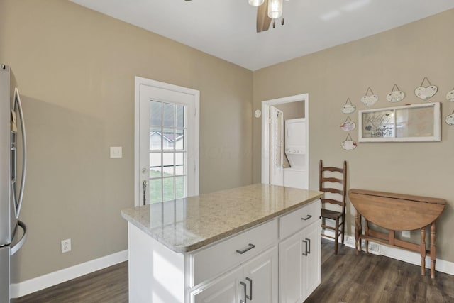 625 E Mulberry St, Lancaster, OH 43130 - kitchen with stainless steel refrigerator with ice dispenser, a ceiling fan, dark wood finished floors, light stone countertops, and white cabinetry
