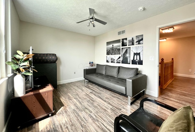 8576 Army Pl, Galloway, OH 43119 - living room featuring wood finished floors, ceiling fan, and a textured ceiling