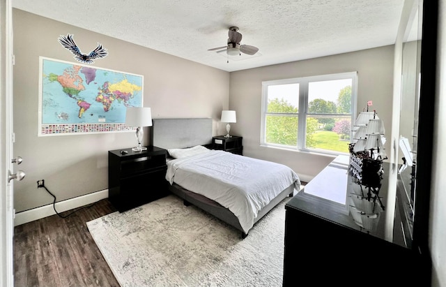 8576 Army Pl, Galloway, OH 43119 - bedroom with wood finished floors, a textured ceiling, and a ceiling fan