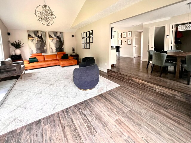 8576 Army Pl, Galloway, OH 43119 - living area featuring a chandelier, wood finished floors, and lofted ceiling