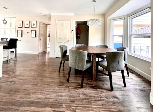 8576 Army Pl, Galloway, OH 43119 - dining area featuring a chandelier, healthy amount of natural light, and dark wood finished floors