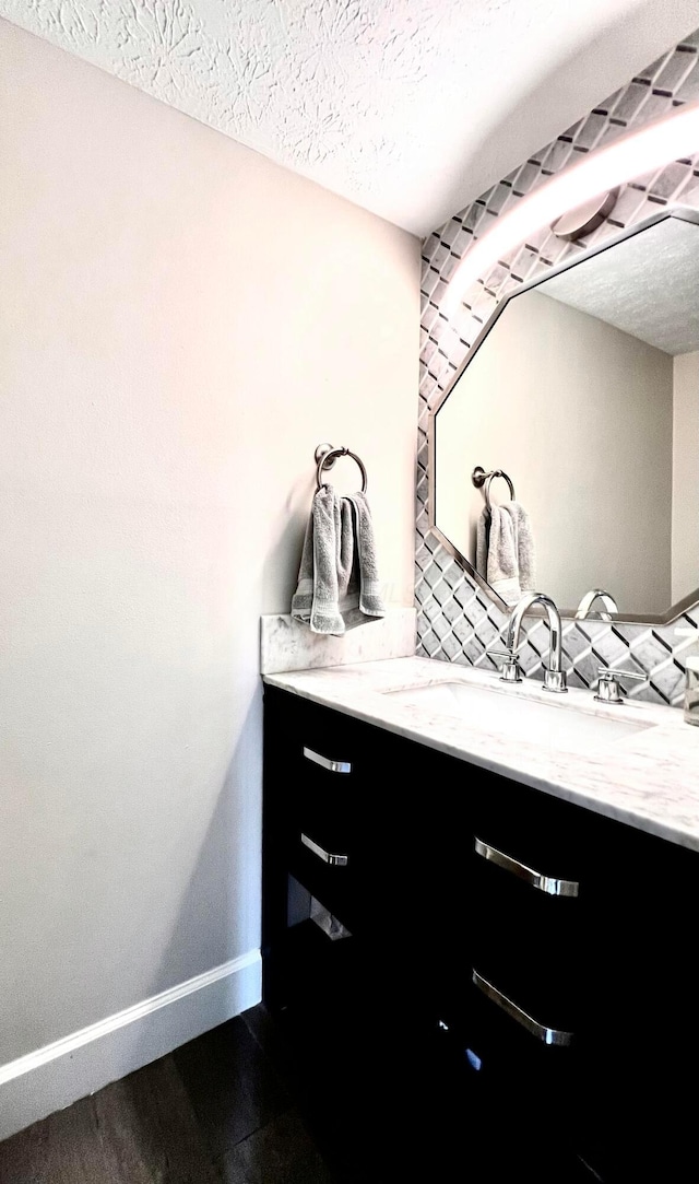 8576 Army Pl, Galloway, OH 43119 - bathroom featuring vanity, a textured ceiling, and wood finished floors