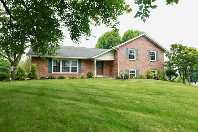 249 Orchard View Dr NE, Lancaster, OH 43130 - tri-level home featuring brick siding and a front lawn