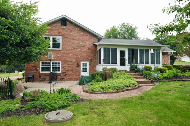 249 Orchard View Dr NE, Lancaster, OH 43130 - rear view of property with a patio area, a yard, brick siding, and a sunroom
