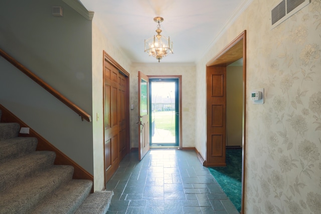 249 Orchard View Dr NE, Lancaster, OH 43130 - foyer entrance with stairs, a chandelier, and crown molding