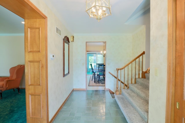 249 Orchard View Dr NE, Lancaster, OH 43130 - entryway with a chandelier, stairway, ornamental molding, and stone finish floors