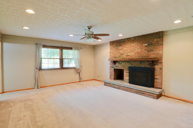 249 Orchard View Dr NE, Lancaster, OH 43130 - unfurnished living room featuring carpet floors, ceiling fan, a brick fireplace, and recessed lighting