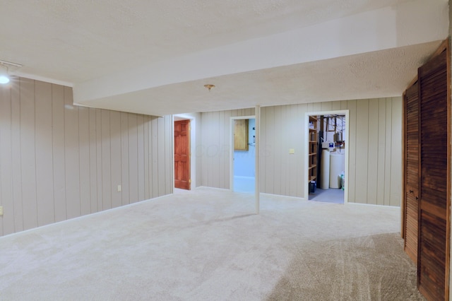 249 Orchard View Dr NE, Lancaster, OH 43130 - finished below grade area featuring carpet flooring, wooden walls, and a textured ceiling