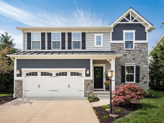 153 Shawnee Dr, Pickerington, OH 43147 - craftsman inspired home with stone siding, a standing seam roof, an attached garage, driveway, and a metal roof