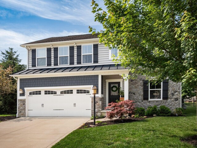 153 Shawnee Dr, Pickerington, OH 43147 - view of front of house featuring a standing seam roof, stone siding, concrete driveway, and an attached garage