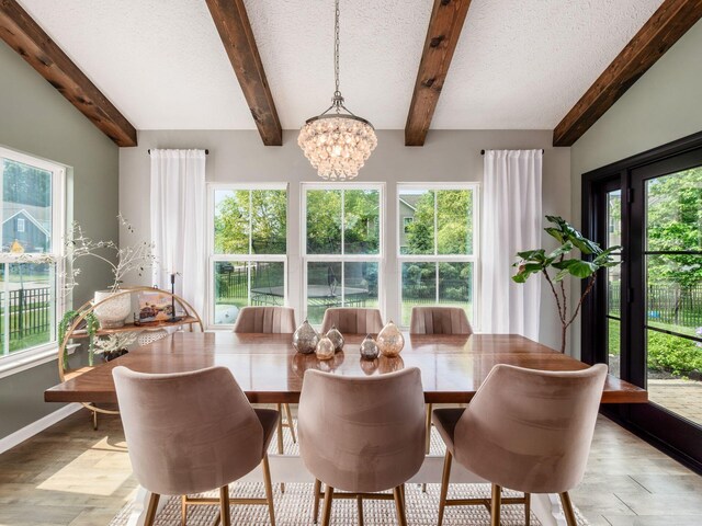 153 Shawnee Dr, Pickerington, OH 43147 - dining space with a chandelier, beamed ceiling, a textured ceiling, and light wood-style flooring