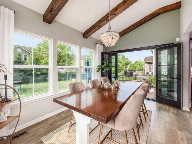 153 Shawnee Dr, Pickerington, OH 43147 - dining area with healthy amount of natural light, light wood-style flooring, and a chandelier