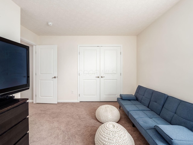 153 Shawnee Dr, Pickerington, OH 43147 - carpeted living room featuring a textured ceiling and baseboards