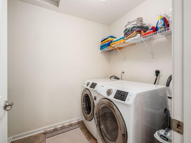 153 Shawnee Dr, Pickerington, OH 43147 - washroom with washing machine and clothes dryer and a textured ceiling