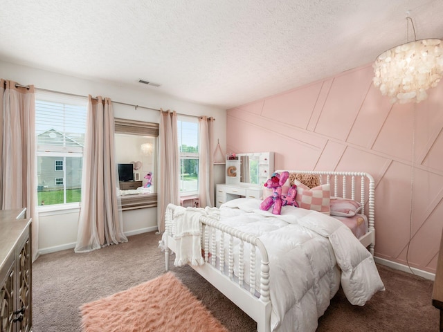 153 Shawnee Dr, Pickerington, OH 43147 - bedroom with carpet floors, a textured ceiling, and a chandelier