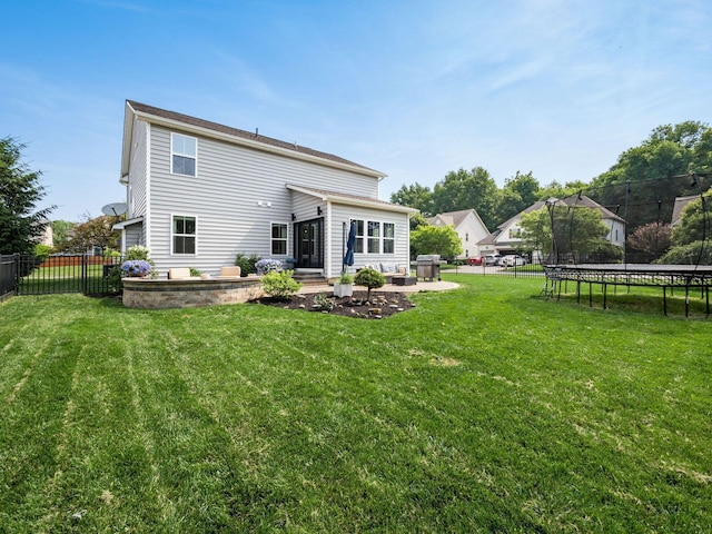 153 Shawnee Dr, Pickerington, OH 43147 - back of house with a trampoline, a patio, and a fenced backyard