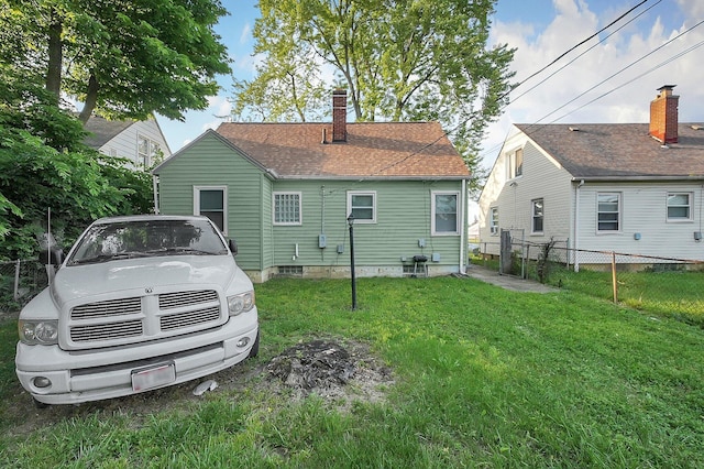 1265 Duxberry Ave, Columbus, OH 43211 - rear view of property featuring a chimney and roof with shingles