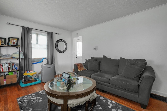 1265 Duxberry Ave, Columbus, OH 43211 - living room featuring wood finished floors, a textured ceiling, and crown molding