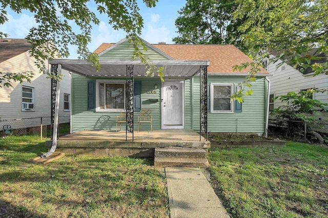 1265 Duxberry Ave, Columbus, OH 43211 - view of front of house with covered porch, a shingled roof, and cooling unit