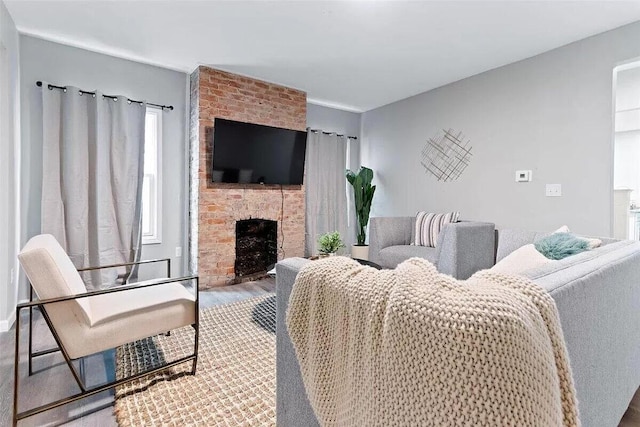 387 N Garfield Ave, Columbus, OH 43203 - living area featuring wood finished floors and a fireplace