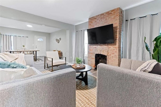 387 N Garfield Ave, Columbus, OH 43203 - living area featuring wood finished floors, a fireplace, and recessed lighting