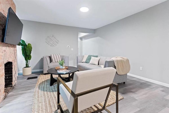 387 N Garfield Ave, Columbus, OH 43203 - living area with a fireplace, wood finished floors, and recessed lighting