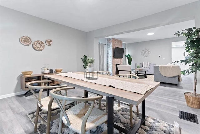 387 N Garfield Ave, Columbus, OH 43203 - dining space featuring light wood finished floors and recessed lighting