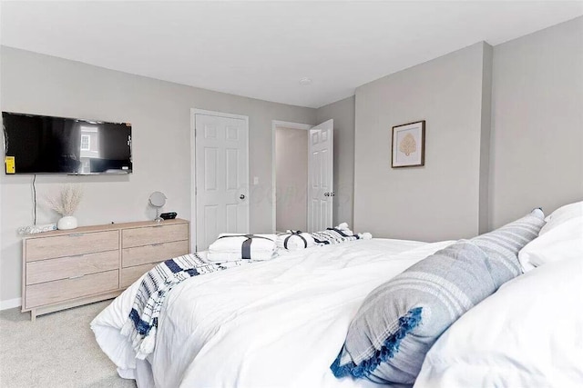 387 N Garfield Ave, Columbus, OH 43203 - bedroom with light carpet and baseboards