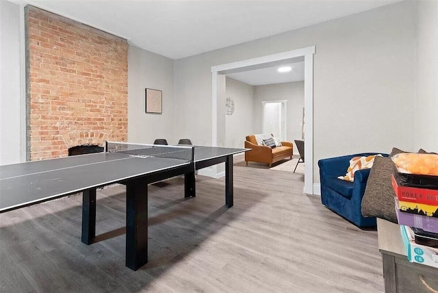 387 N Garfield Ave, Columbus, OH 43203 - rec room with light wood-style flooring and a fireplace