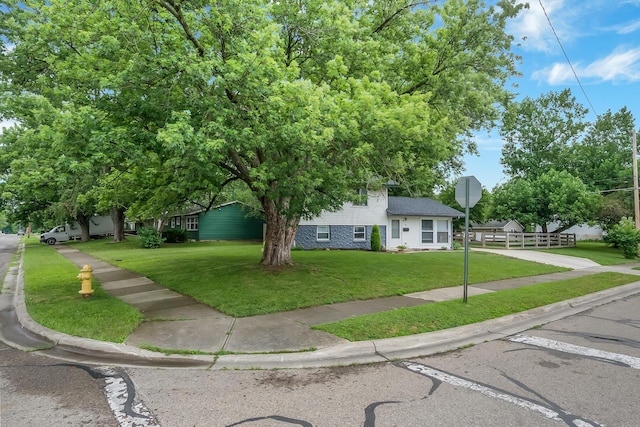 11 Richards Dr, Delaware, OH 43015 - view of front of house featuring a front yard and uncovered parking
