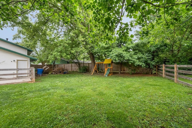 11 Richards Dr, Delaware, OH 43015 - fenced backyard with a playground