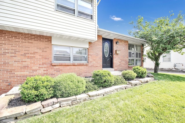 1121 Afton Rd, Columbus, OH 43221 - entrance to property with a yard and brick siding