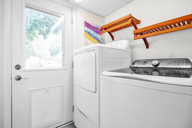 1121 Afton Rd, Columbus, OH 43221 - laundry room featuring healthy amount of natural light and independent washer and dryer